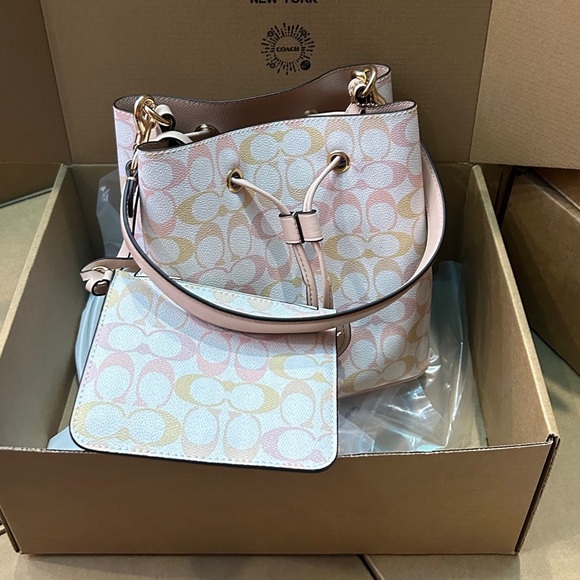 Meet the Posher Handbags - Coach Cream Pink Bucket Bag Crossbody Bag